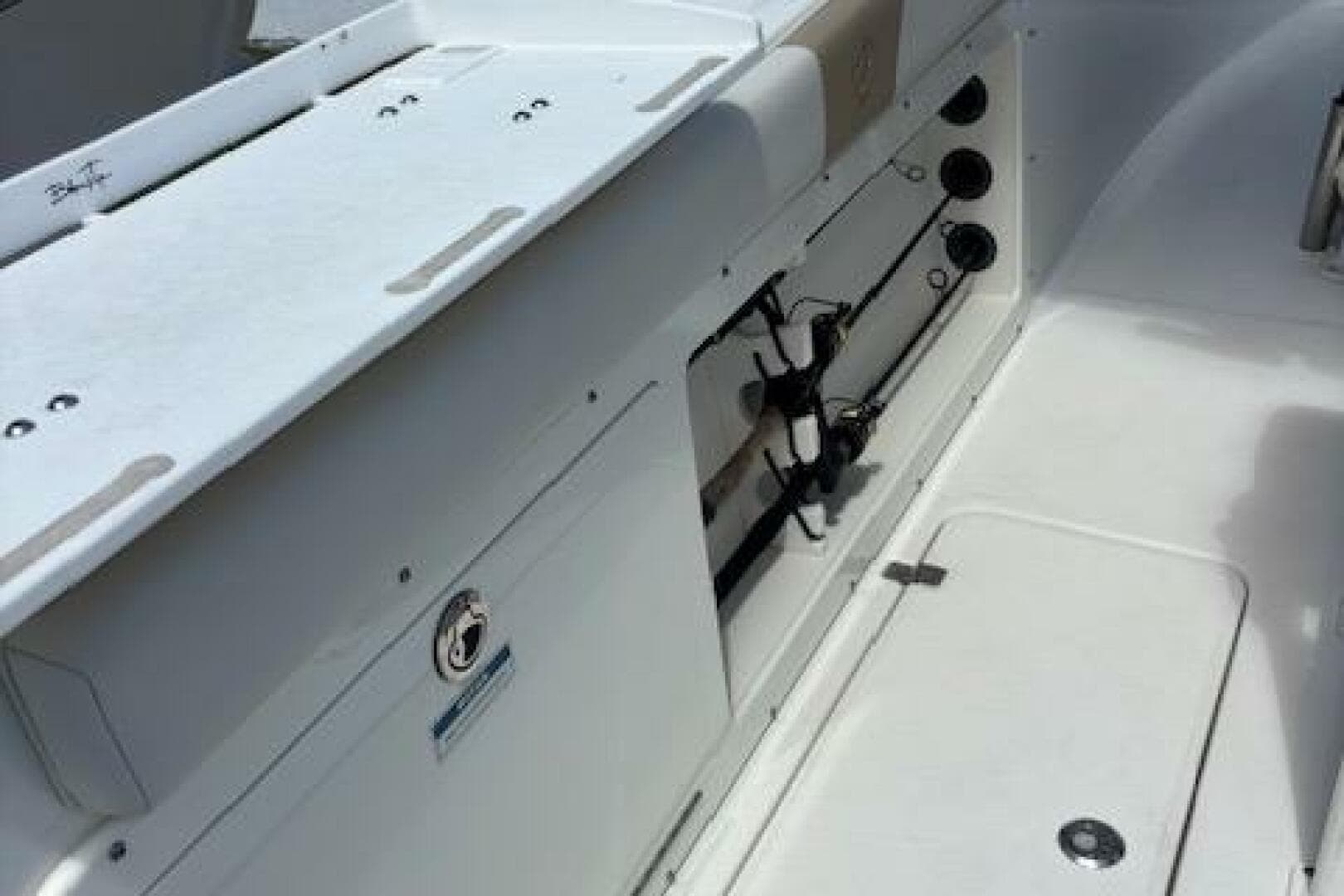 2018 Century 2600 Center Console boat interior with rod holders and storage compartments.
