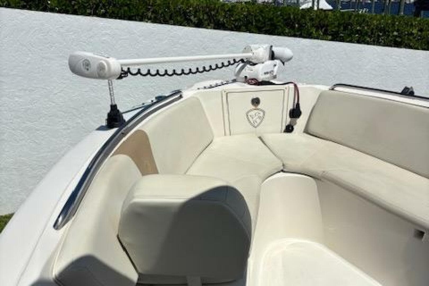 2018 Century 2600 Center Console boat with cushioned seating and mounted equipment.