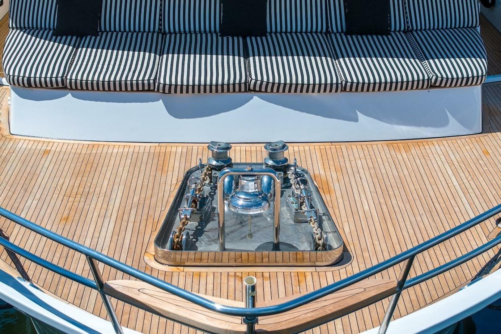 Luxury yacht deck with striped seating, featuring a 1996 ABD 90 Explorer.