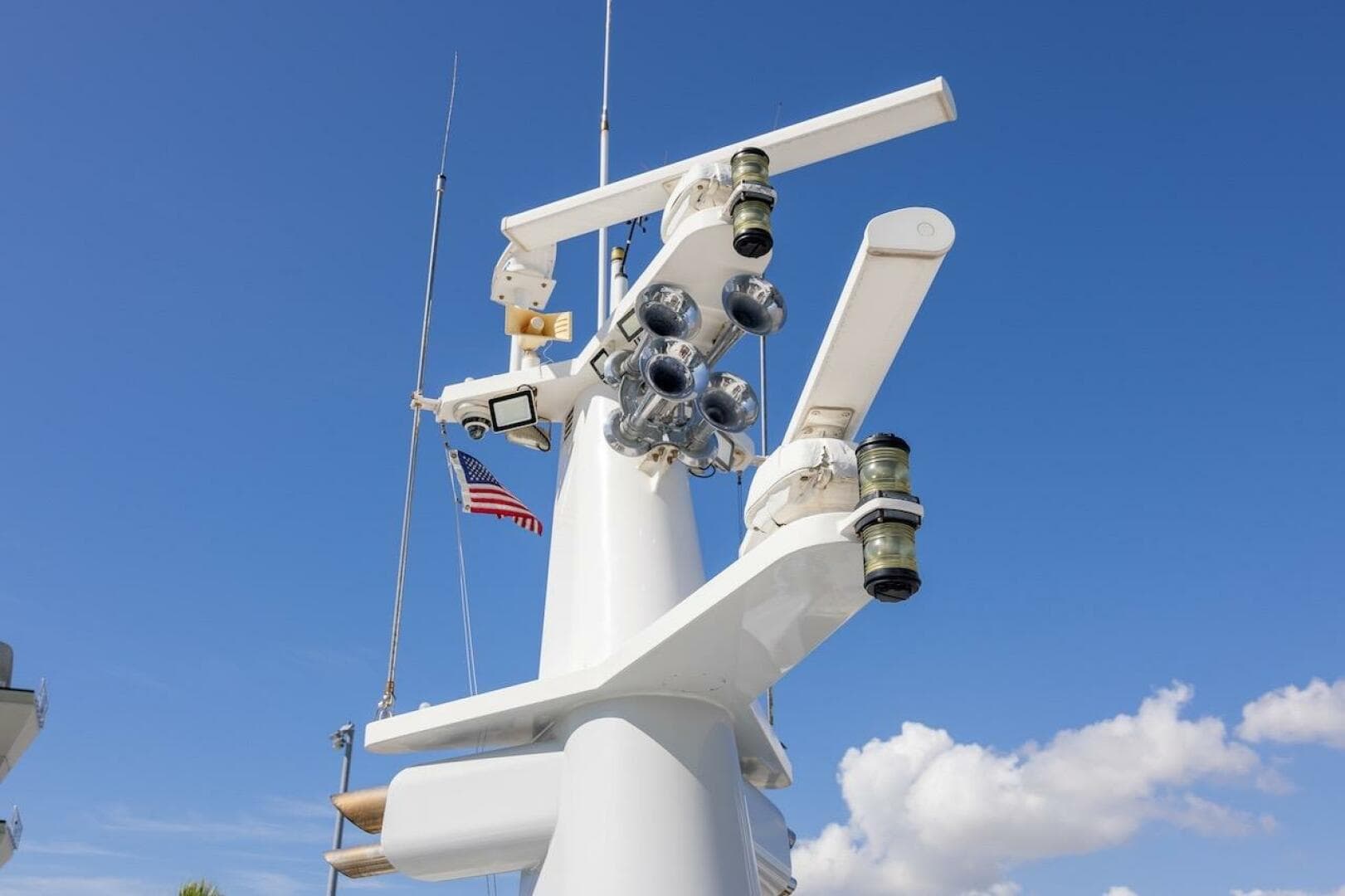 Radar and communication equipment on ABD 90 Explorer yacht, 1996, with American flag.