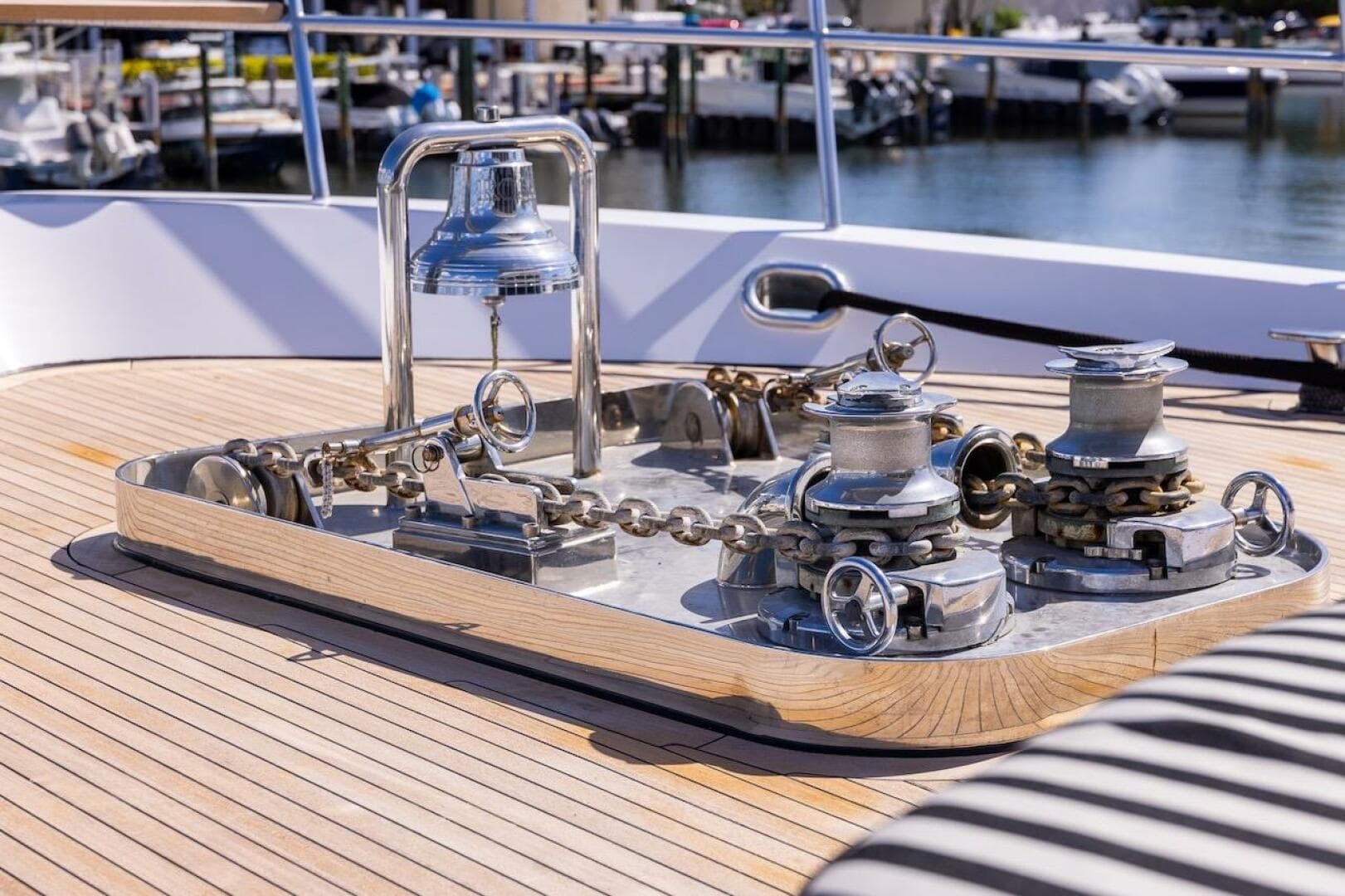 Polished yacht deck with anchor winch and bell, ABD 90 Explorer, 1996 model.