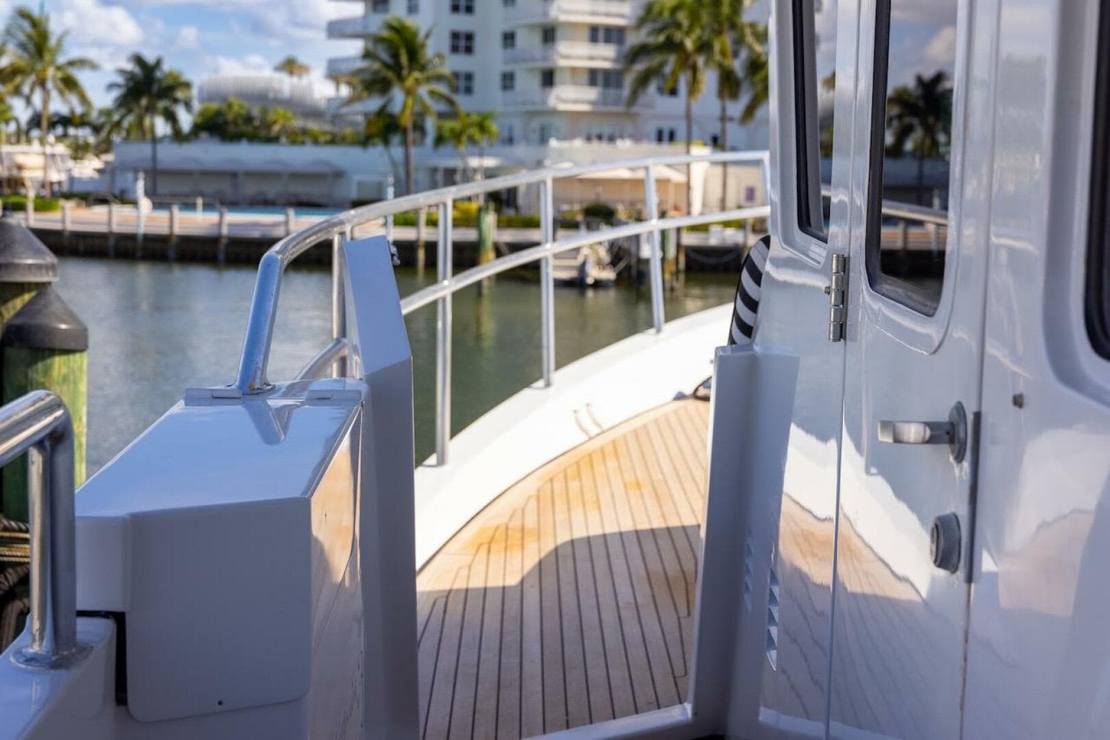 Deck view of 1996 ABD 90 Explorer yacht with wooden flooring and railing.