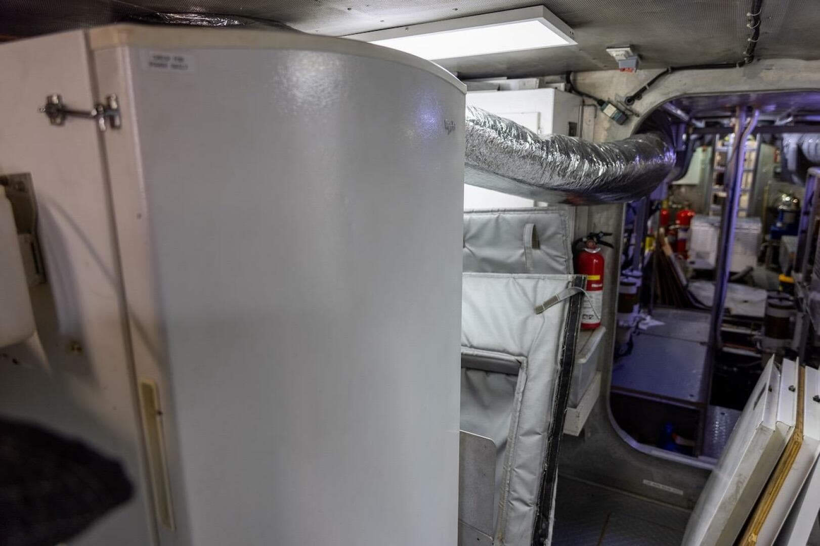 Interior of a 1996 ABD 90 Explorer yacht, featuring equipment and safety gear.