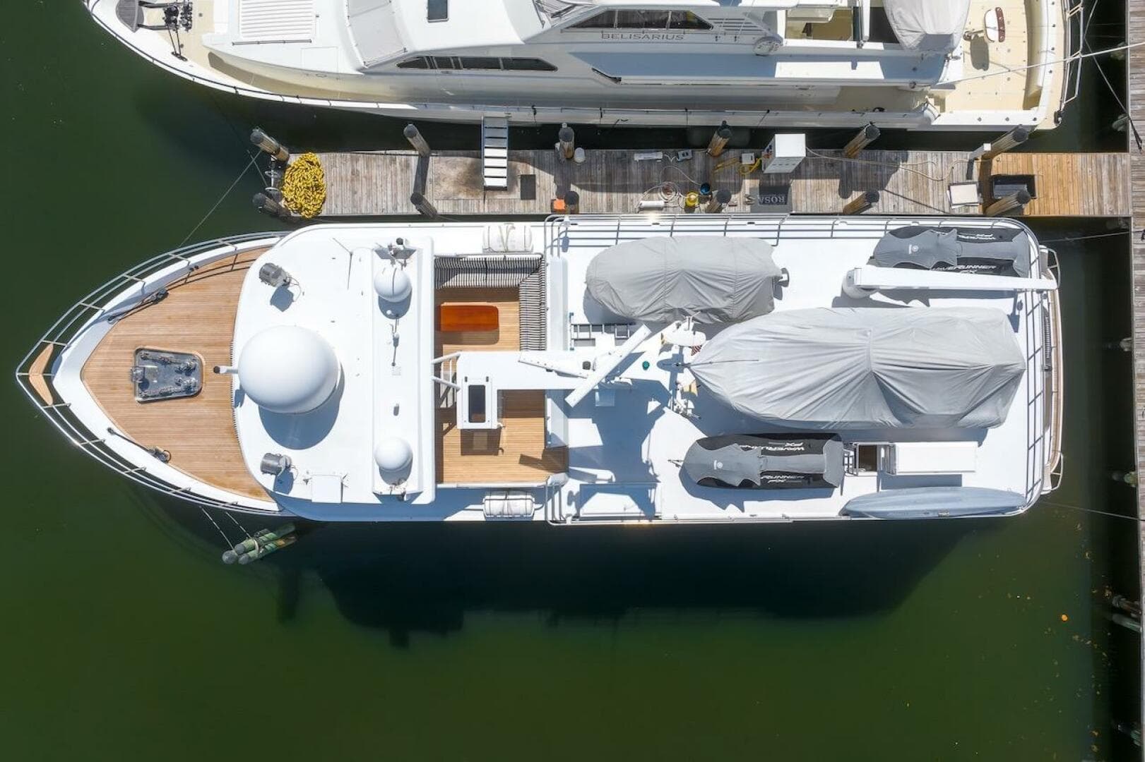Aerial view of 1996 ABD 90 Explorer yacht docked at marina.