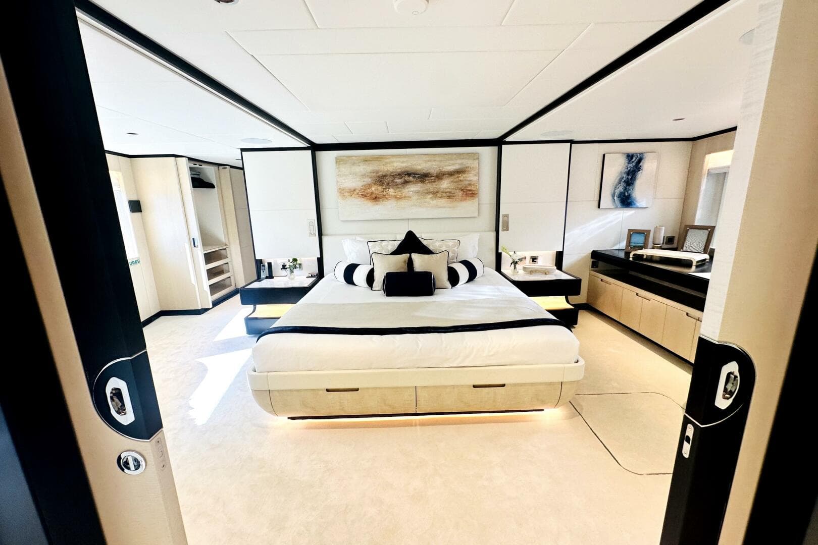Luxurious 2023 Majesty 120 yacht bedroom with modern decor and elegant furnishings.