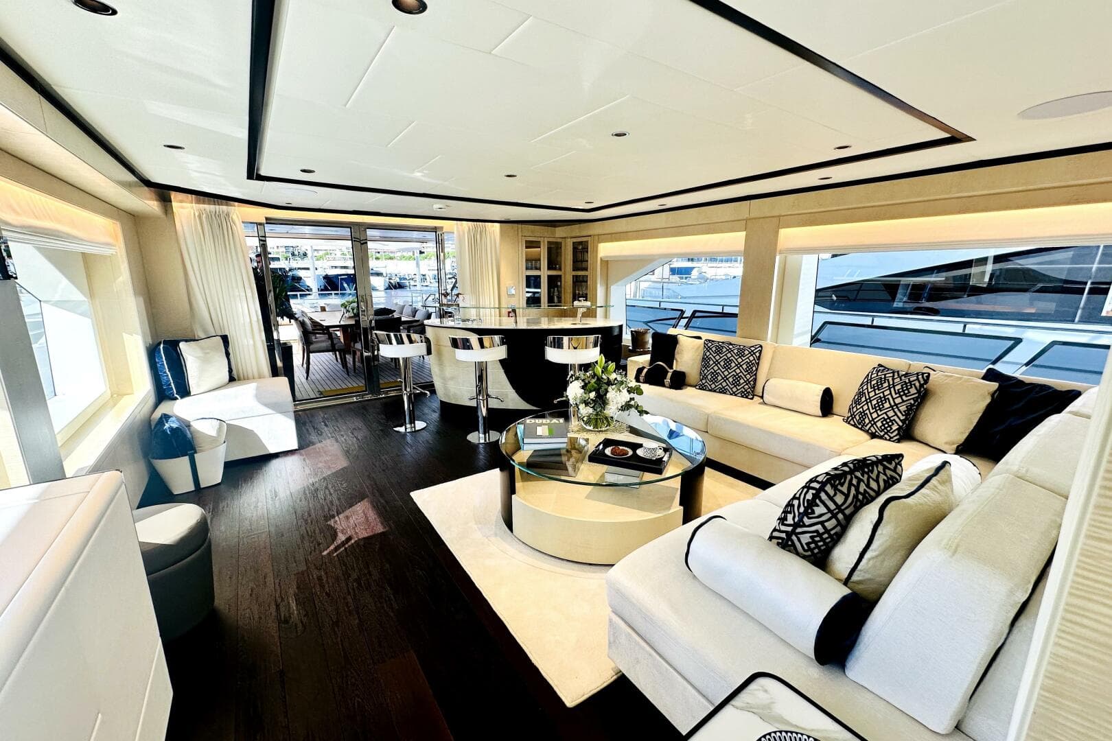 Luxurious interior of 2023 Majesty 120 yacht with elegant seating and modern decor.