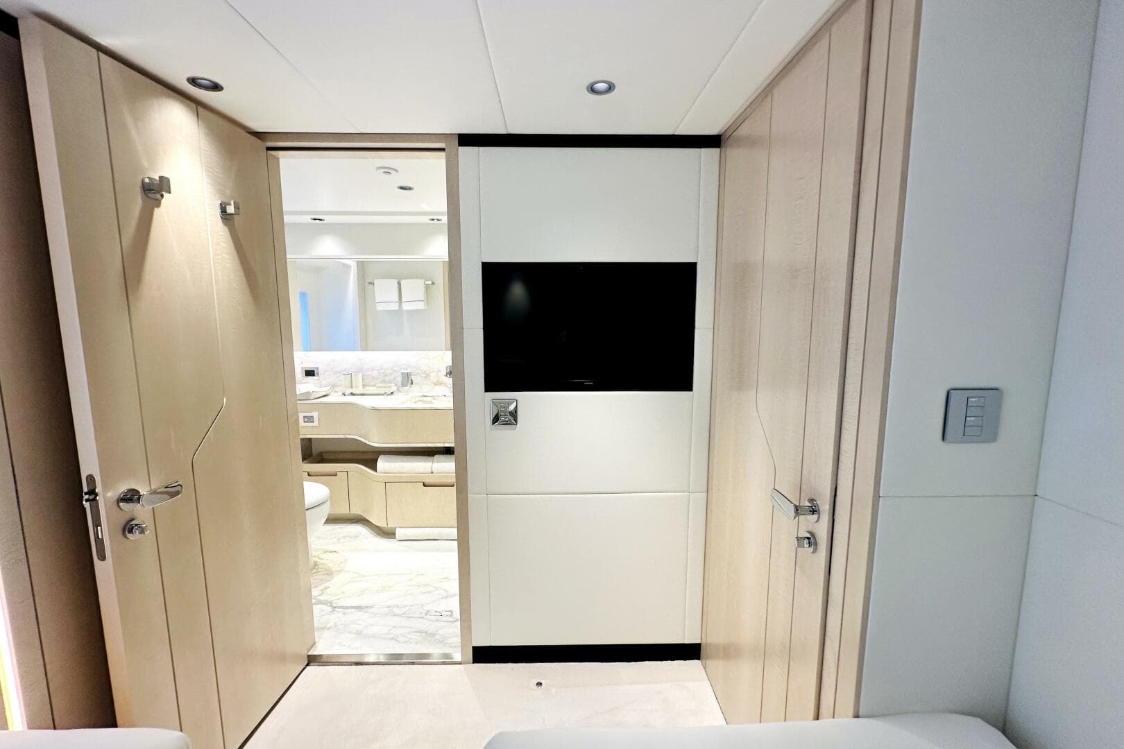 Luxurious interior of 2023 Majesty 120 yacht featuring modern bathroom and sleek design elements.