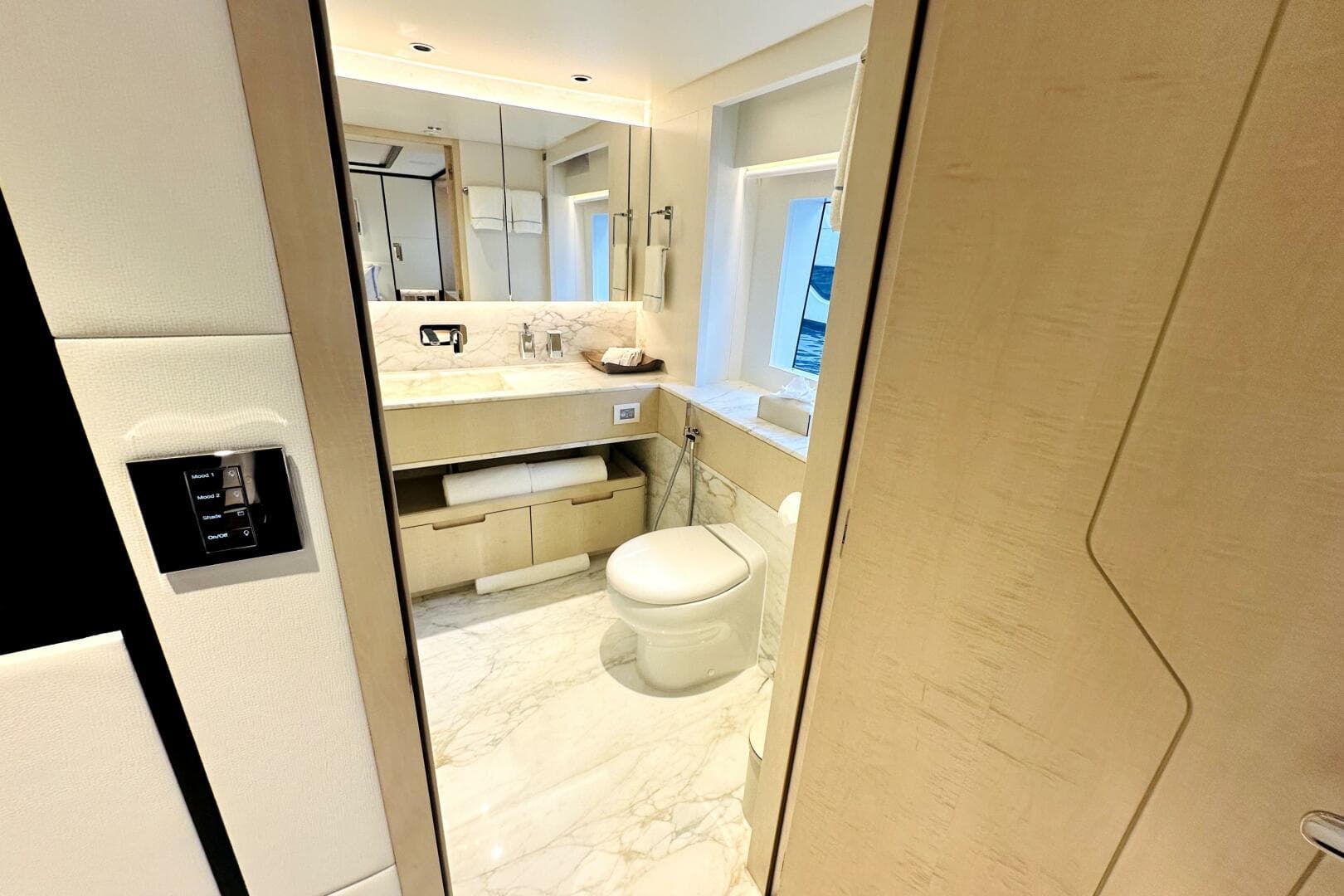 Luxurious bathroom interior on 2023 Majesty 120 yacht, featuring marble flooring and modern fixtures.