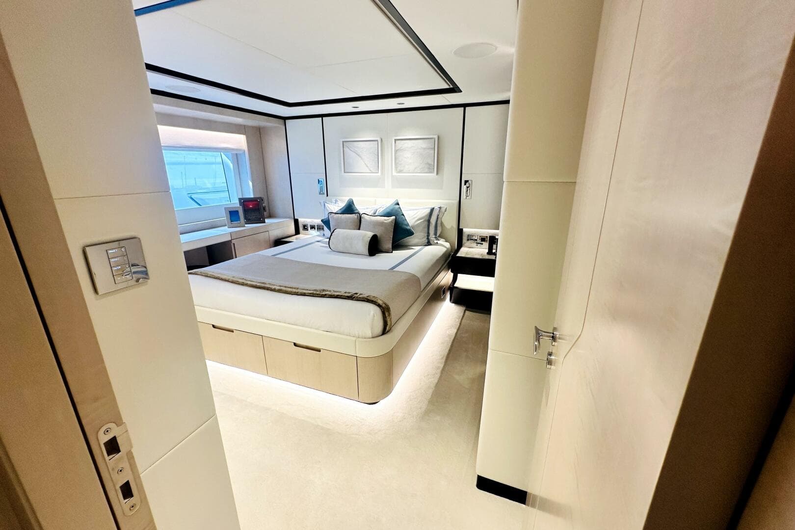 Luxurious bedroom interior on 2023 Majesty 120 yacht, featuring modern design and elegant furnishings.