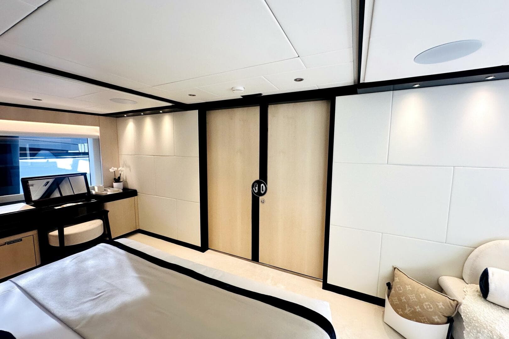 Luxurious 2023 Majesty 120 yacht bedroom with modern decor and elegant furnishings.