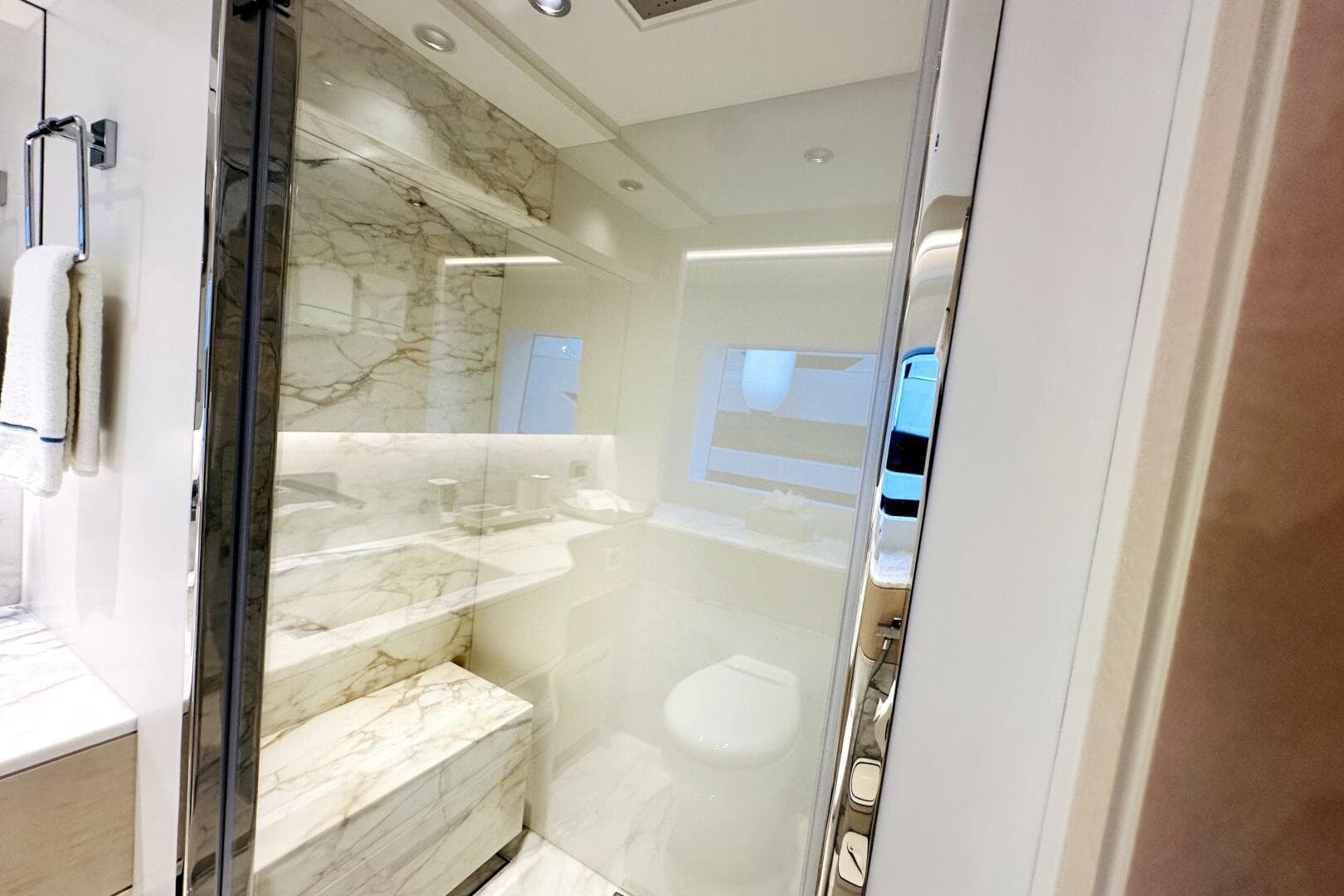 Luxurious bathroom with marble accents in 2023 Majesty 120 yacht.