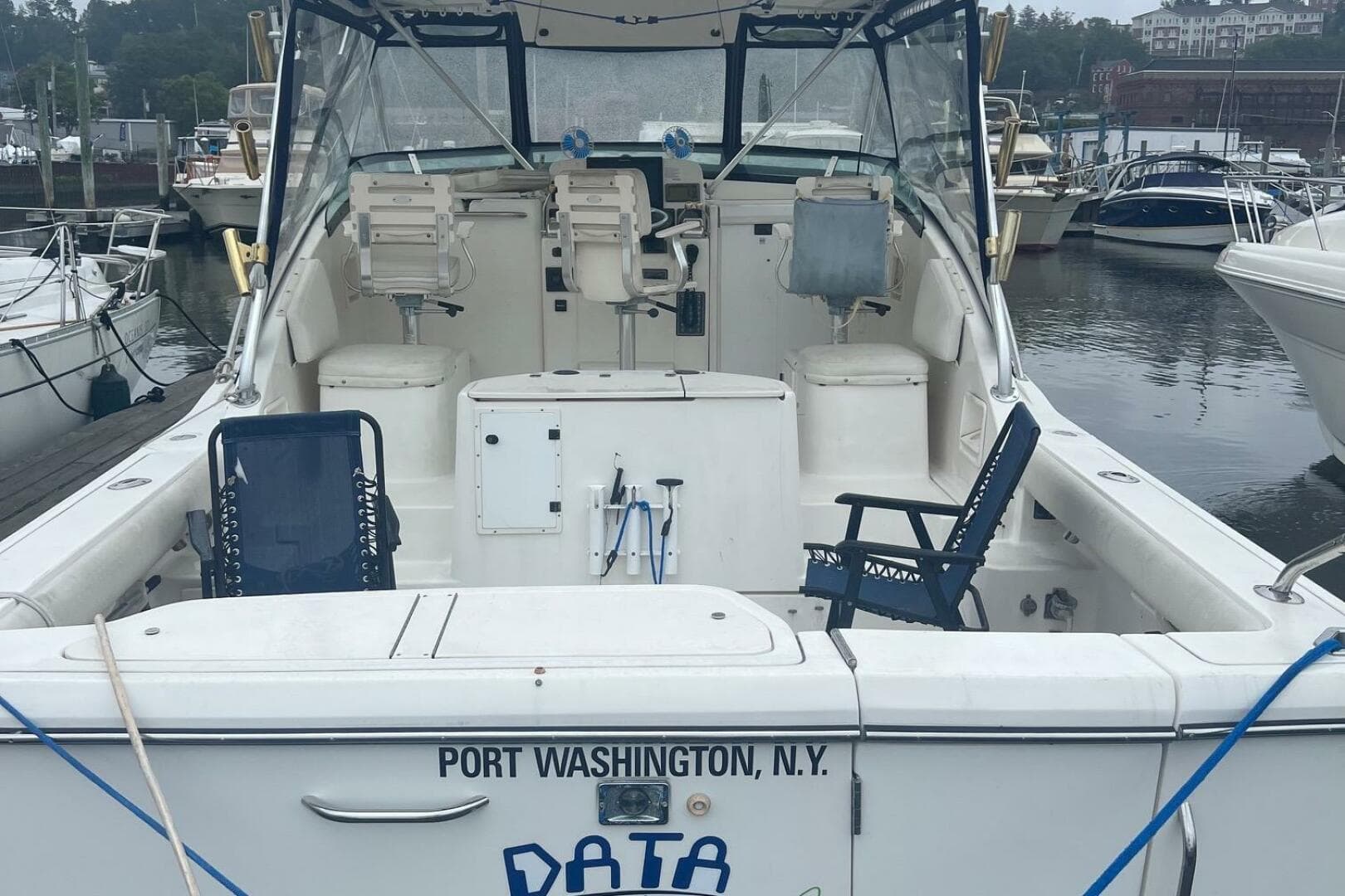 2001 Pursuit 3000 Offshore boat docked in Port Washington, N.Y., with seating and equipment.