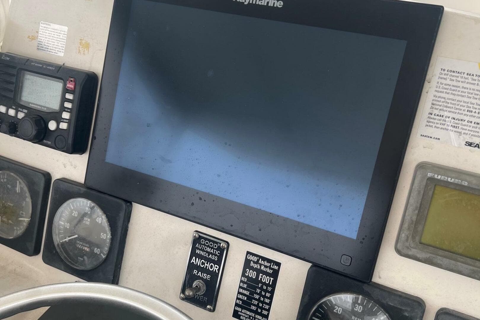 Control panel of a 2001 Pursuit 3000 Offshore boat with navigation and communication equipment.