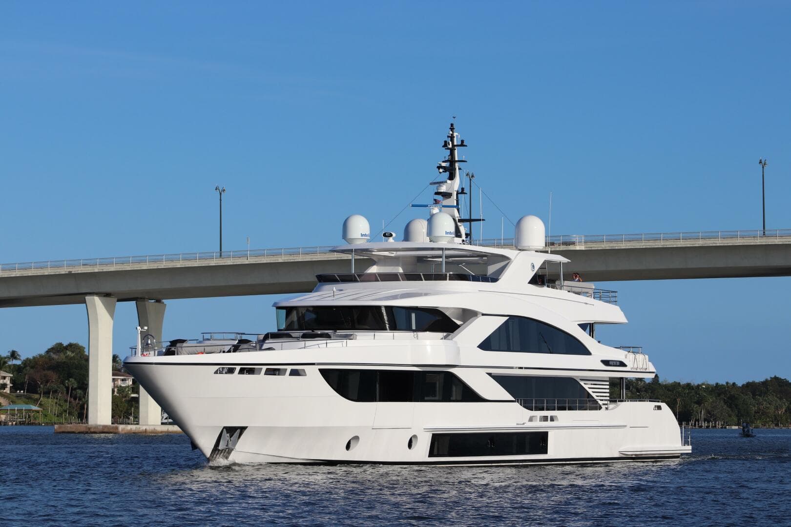 Luxury Majesty 140 yacht cruising under a bridge, 2020 model.