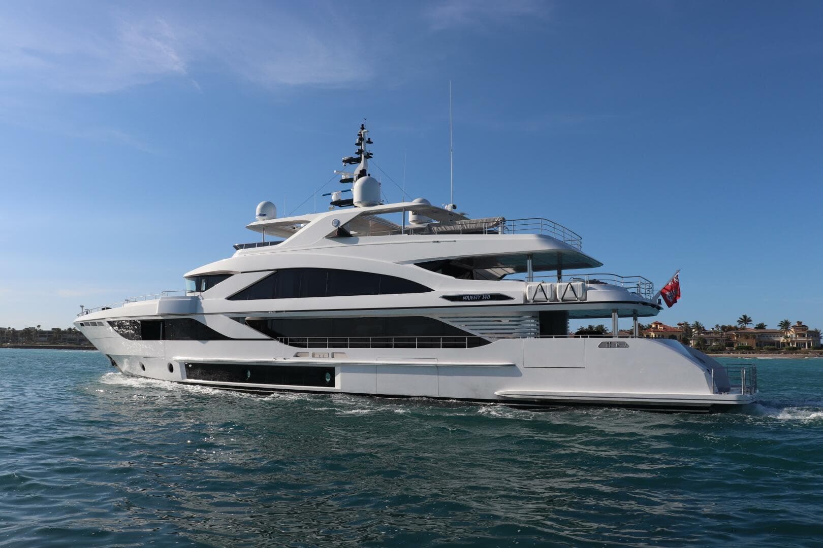 Luxurious 2020 Majesty 140 yacht cruising on clear blue waters.