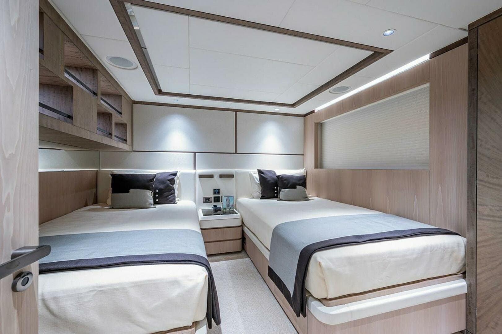 Luxurious twin bedroom in 2020 Majesty 140 yacht, featuring modern design and elegant decor.