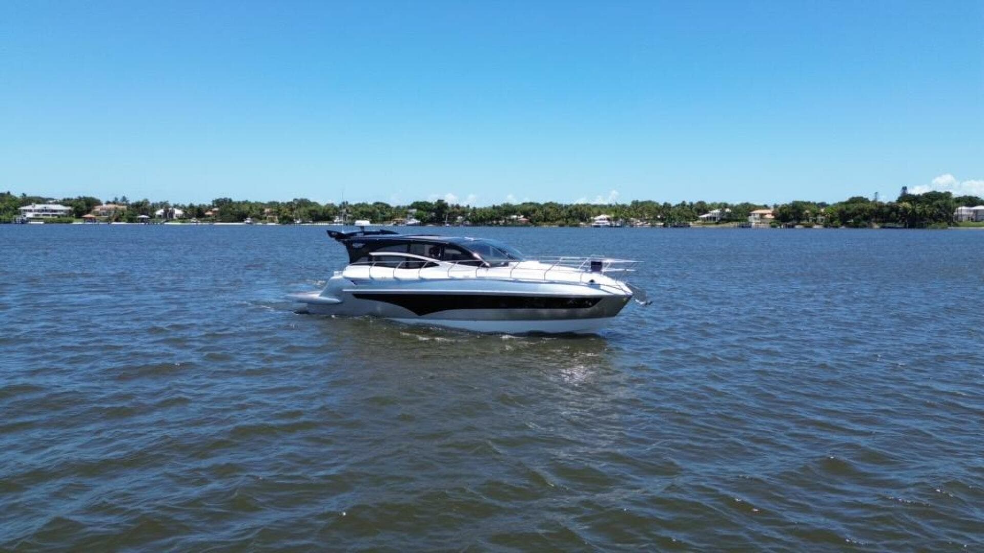 2025 Real 40 HT Luxury yacht cruising on a sunny day.