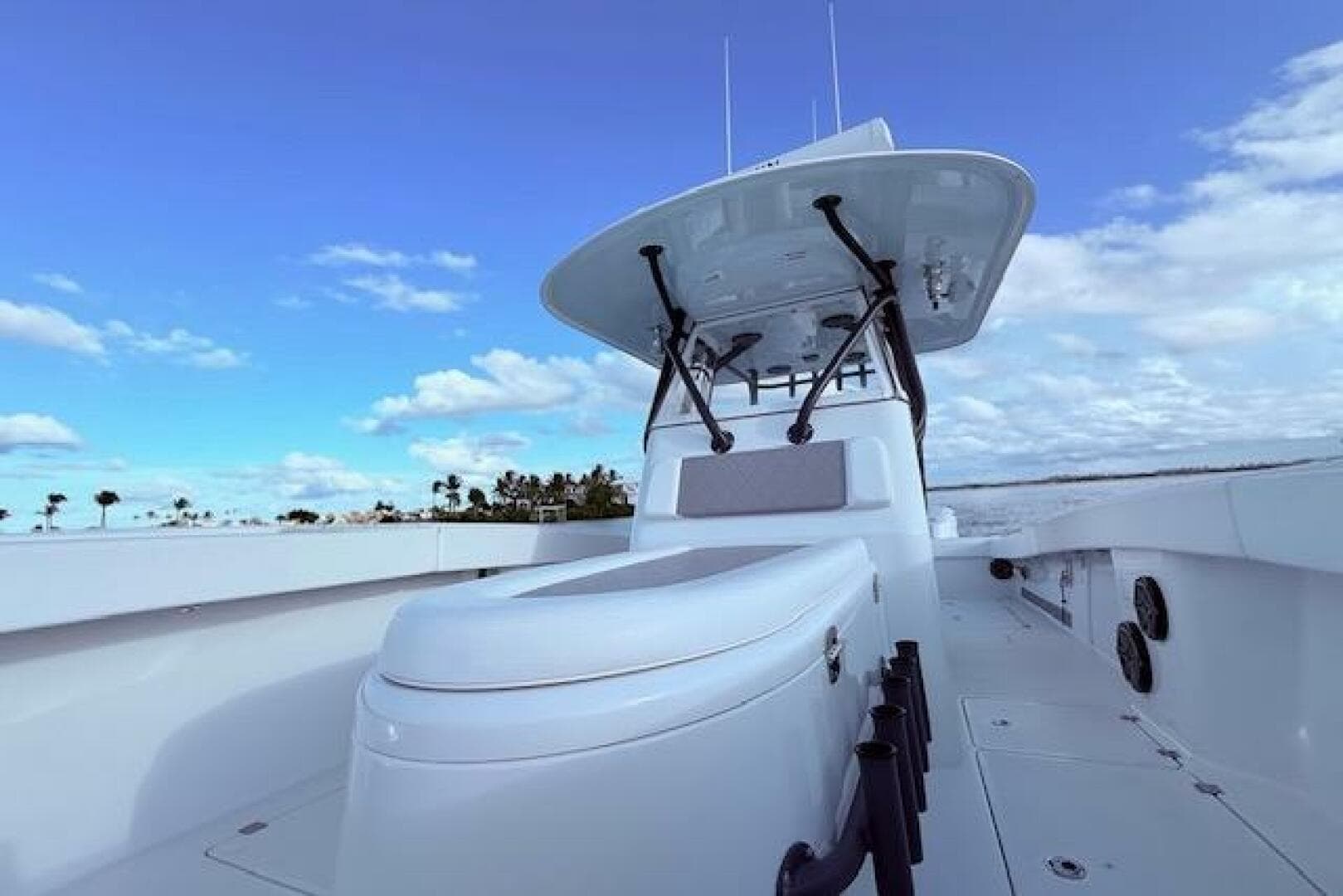 2019 Freeman 34 boat with sleek design, open deck, and clear blue sky background.
