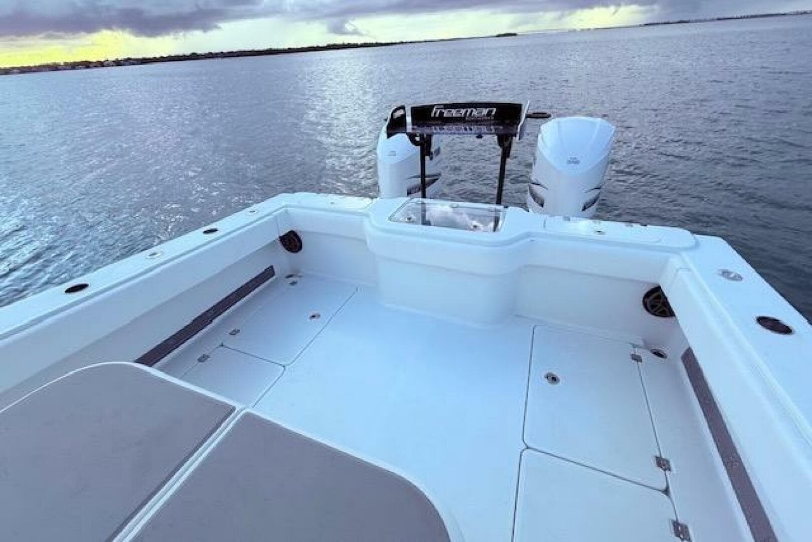 Freeman 34 boat deck, 2019 model, with dual engines on calm water.