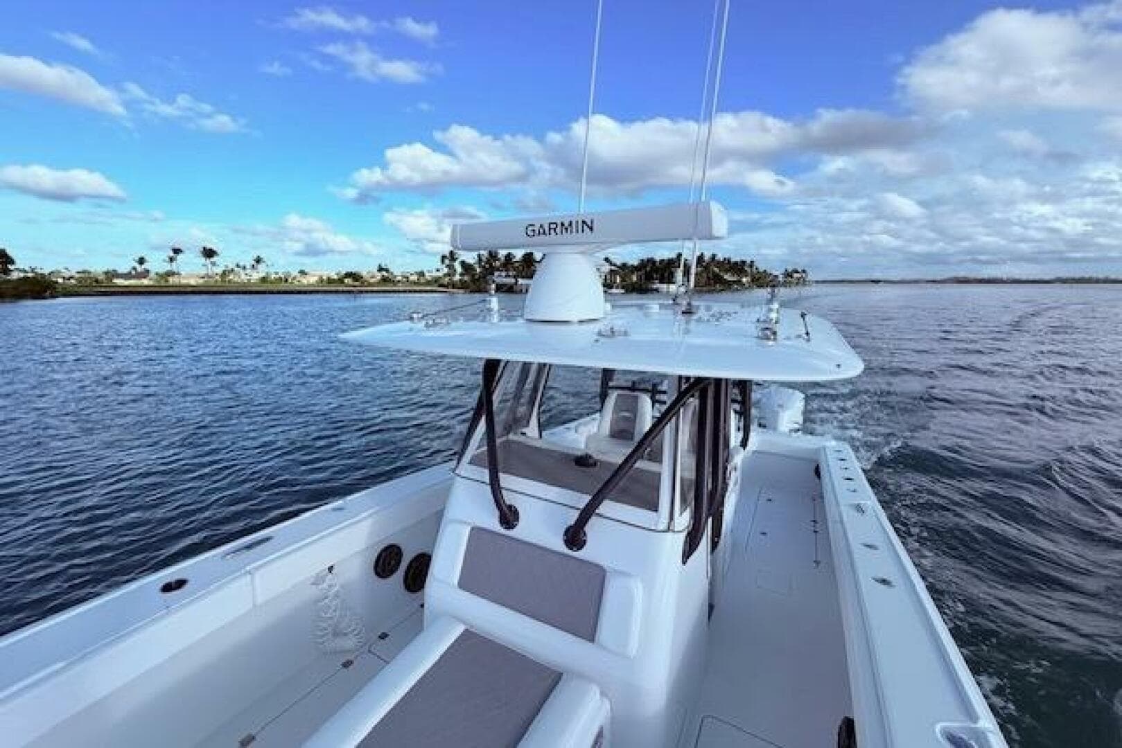 2019 Freeman 34 boat on calm water under a blue sky.