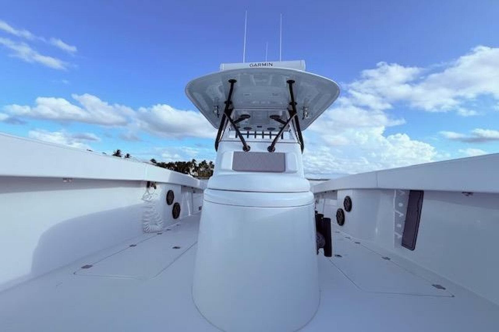 2019 Freeman 34 boat with Garmin equipment, clear sky, and ocean view.