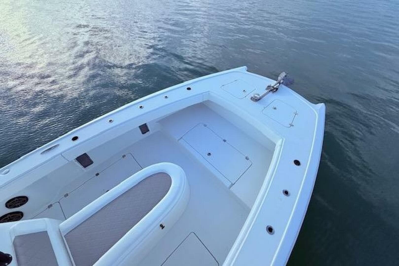 2019 Freeman 34 boat deck on calm water, showcasing spacious seating and storage.