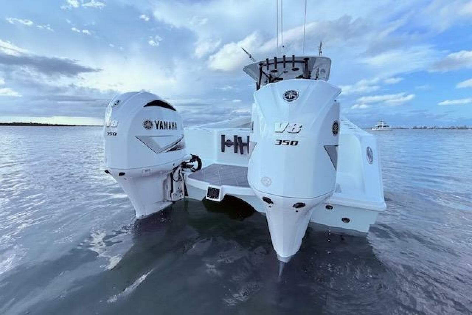 2019 Freeman 34 boat with twin Yamaha V8 350 engines on calm water.