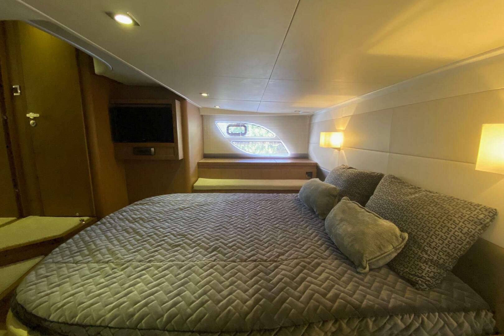 Luxurious cabin interior of 2014 Beneteau Gran Turismo 44 yacht with cozy bedding.