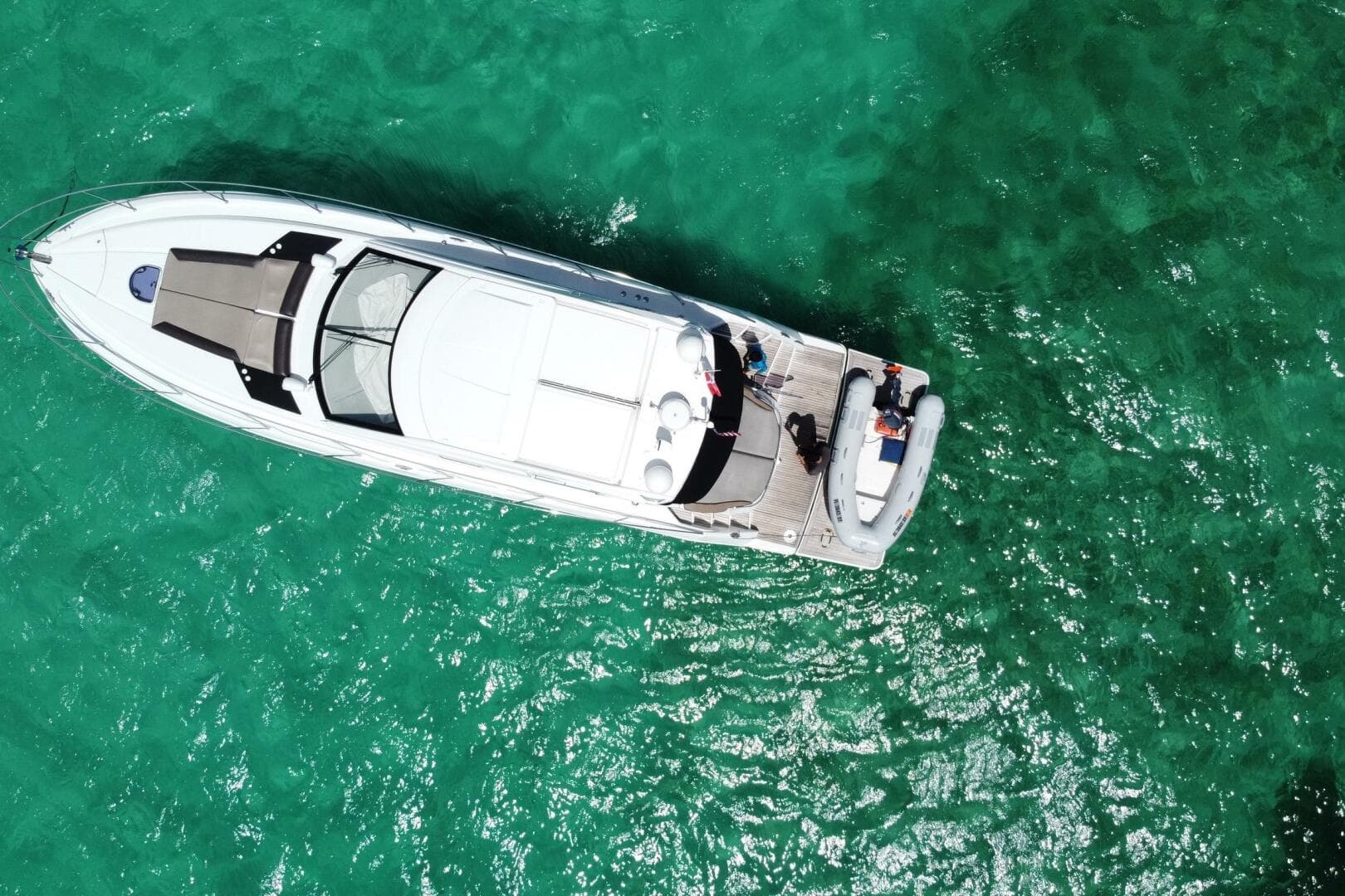 Aerial view of 2014 Beneteau Gran Turismo 44 yacht on turquoise water.