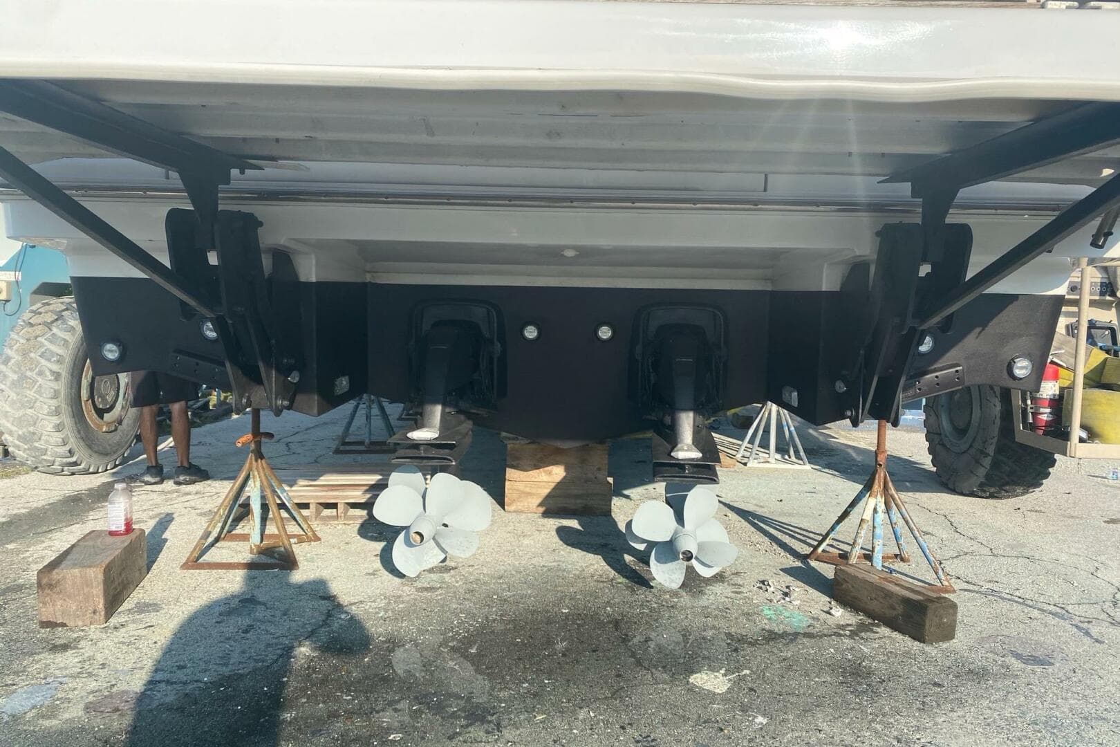 Rear view of 2014 Beneteau Gran Turismo 44 boat on stands, showing dual propellers.