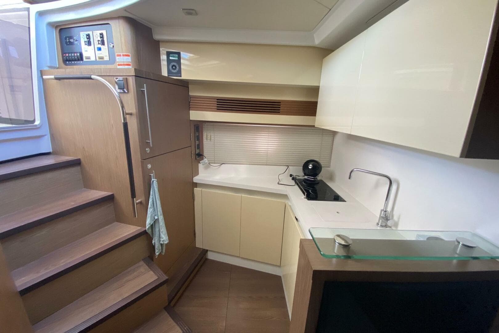 2014 Beneteau Gran Turismo 44 yacht interior kitchen with modern cabinetry and appliances.
