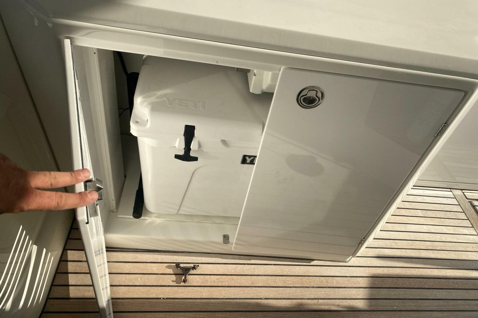 Storage compartment on 2014 Beneteau Gran Turismo 44 with Yeti cooler inside.