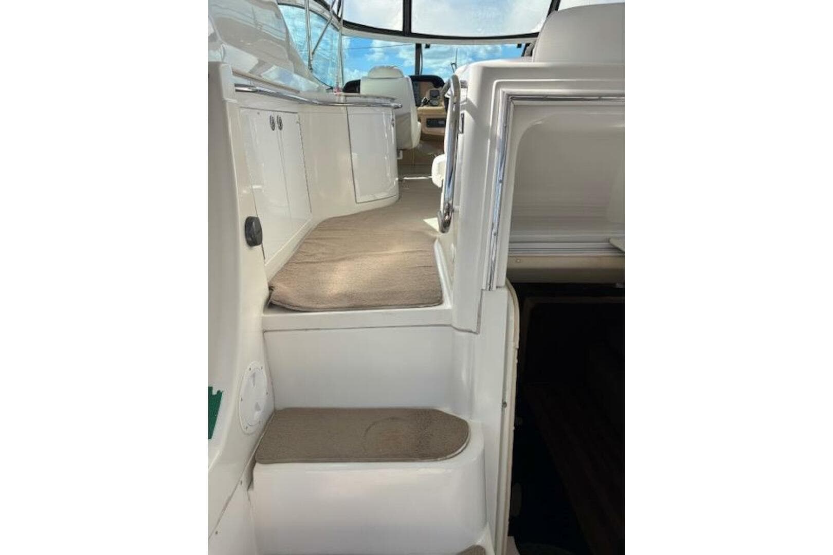 Interior view of 2004 Carver 466 Motor Yacht, featuring carpeted steps and sleek design.