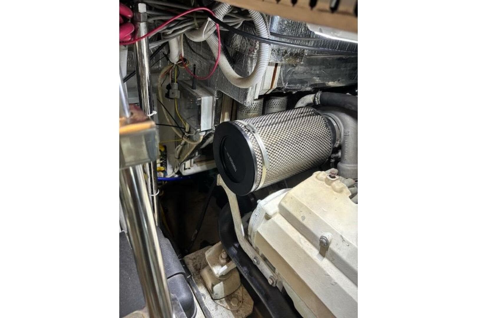 Engine room of 2004 Carver 466 Motor Yacht, showcasing mechanical components and wiring.