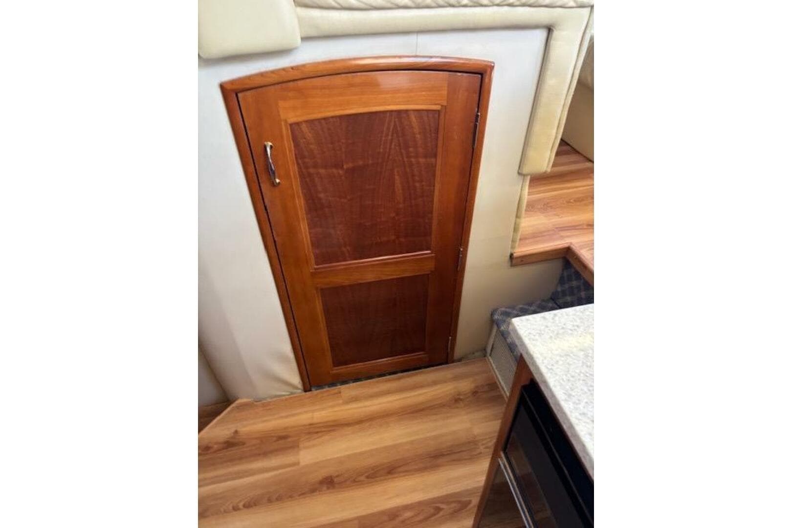 Wooden door inside 2004 Carver 466 Motor Yacht, featuring elegant interior design.