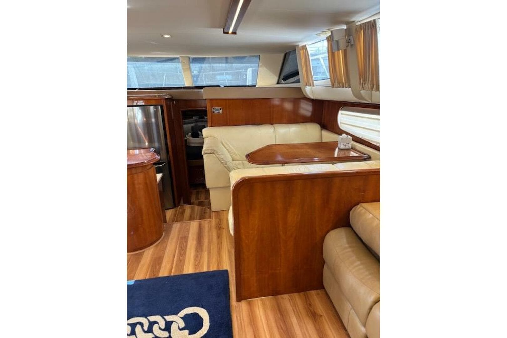 Interior of 2004 Carver 466 Motor Yacht with elegant wood and leather furnishings.