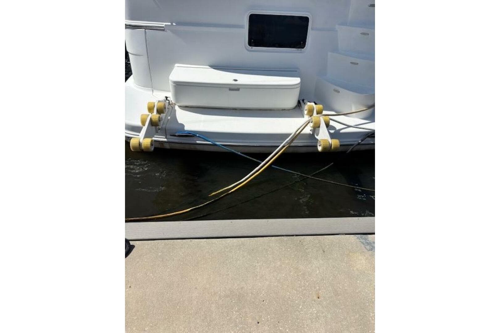 2004 Carver 466 Motor Yacht docked with mooring lines and fenders.