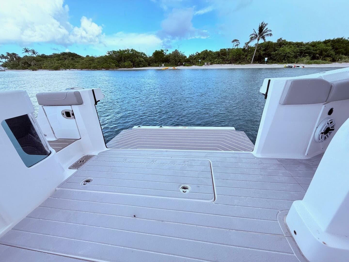 2024 Scout 400 LXF boat deck overlooking serene water and lush shoreline.