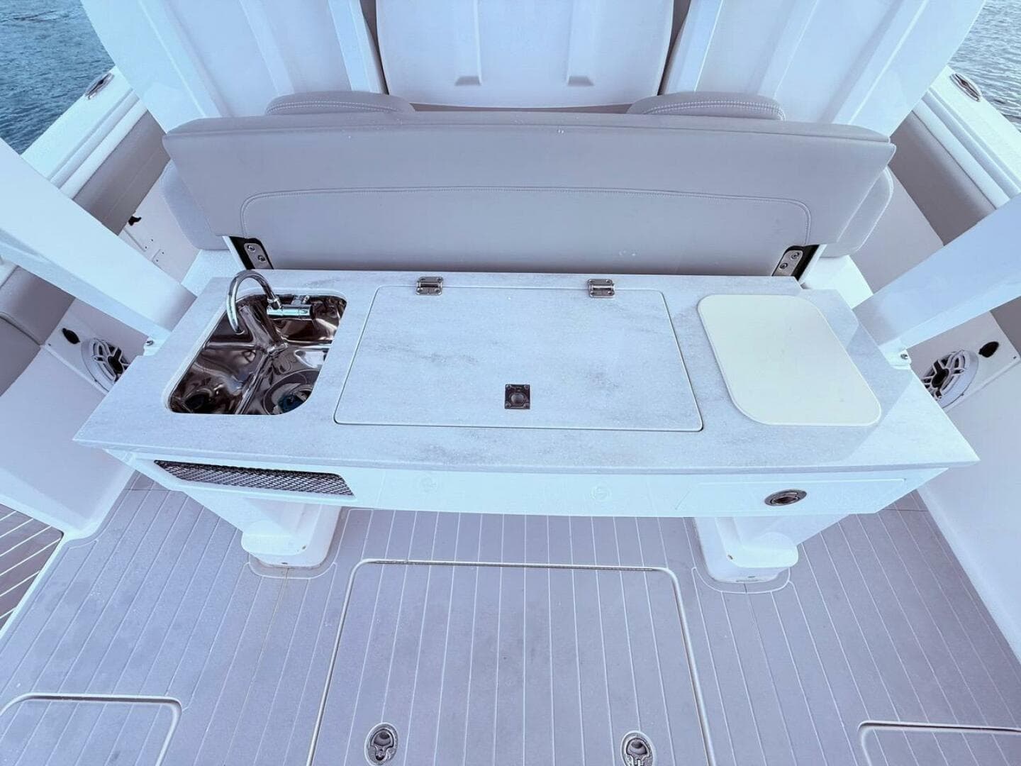 2024 Scout 400 LXF boat interior with sink and cutting board on deck.