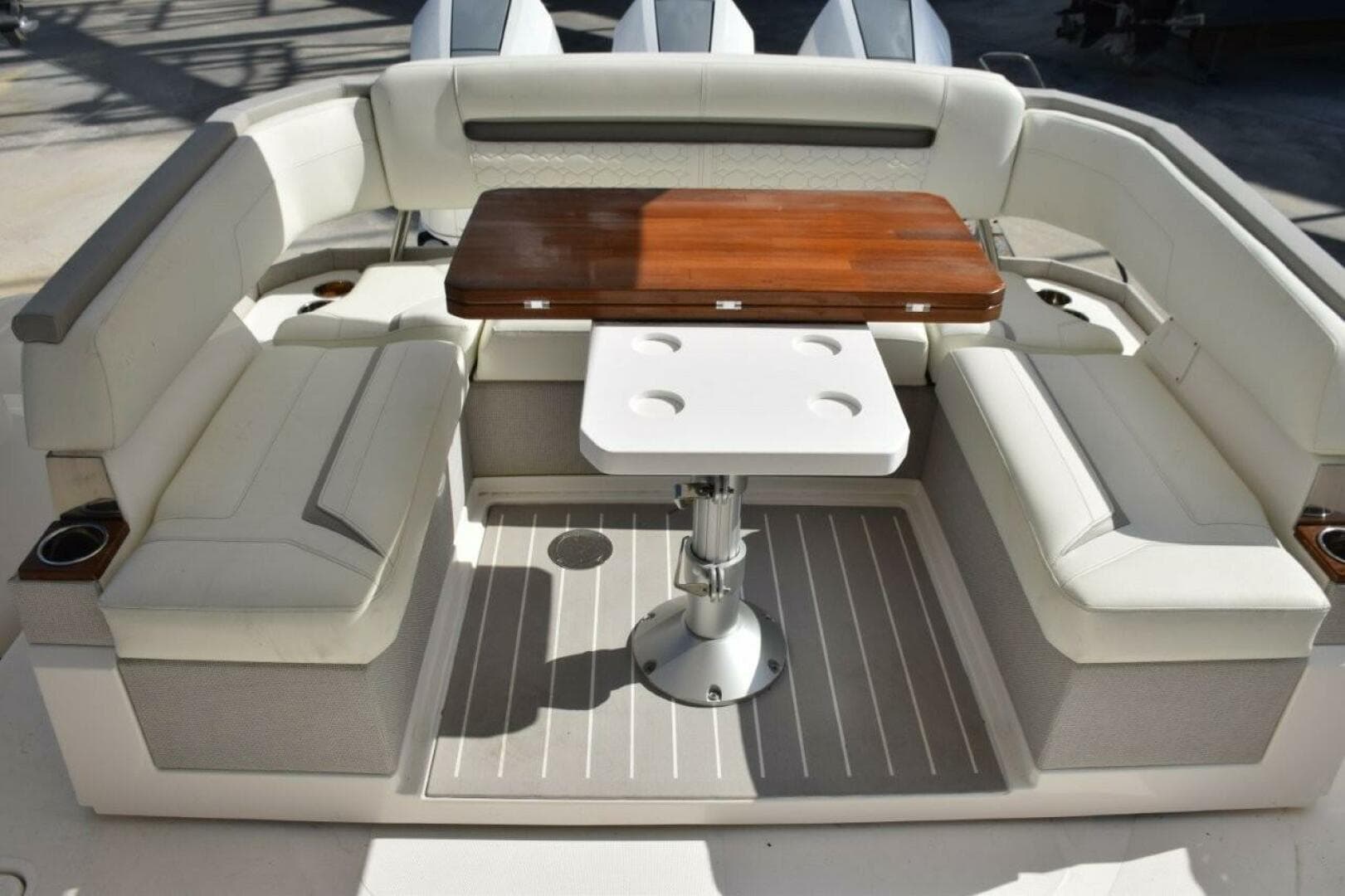 Cockpit With Rotating Aft Seating Console, Wood Tabletop Which Folds Open Or Can Be Lowered To Make Sunbed