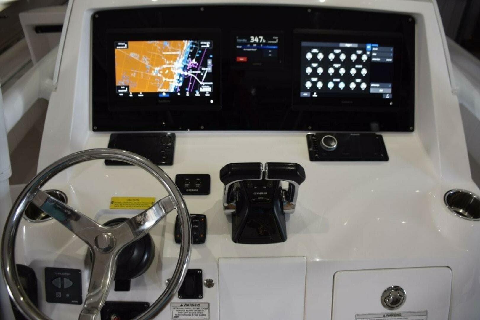Dual Garmin 12 Inch Displays With Garmin Autopilot Between. Digital Switching For Boat Systems Via Garmin.