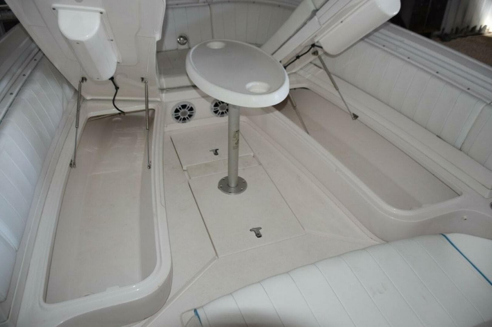 Larger Storage Compartments Accessed With Gas Shock Lifts Beneath Forward Seating Bases