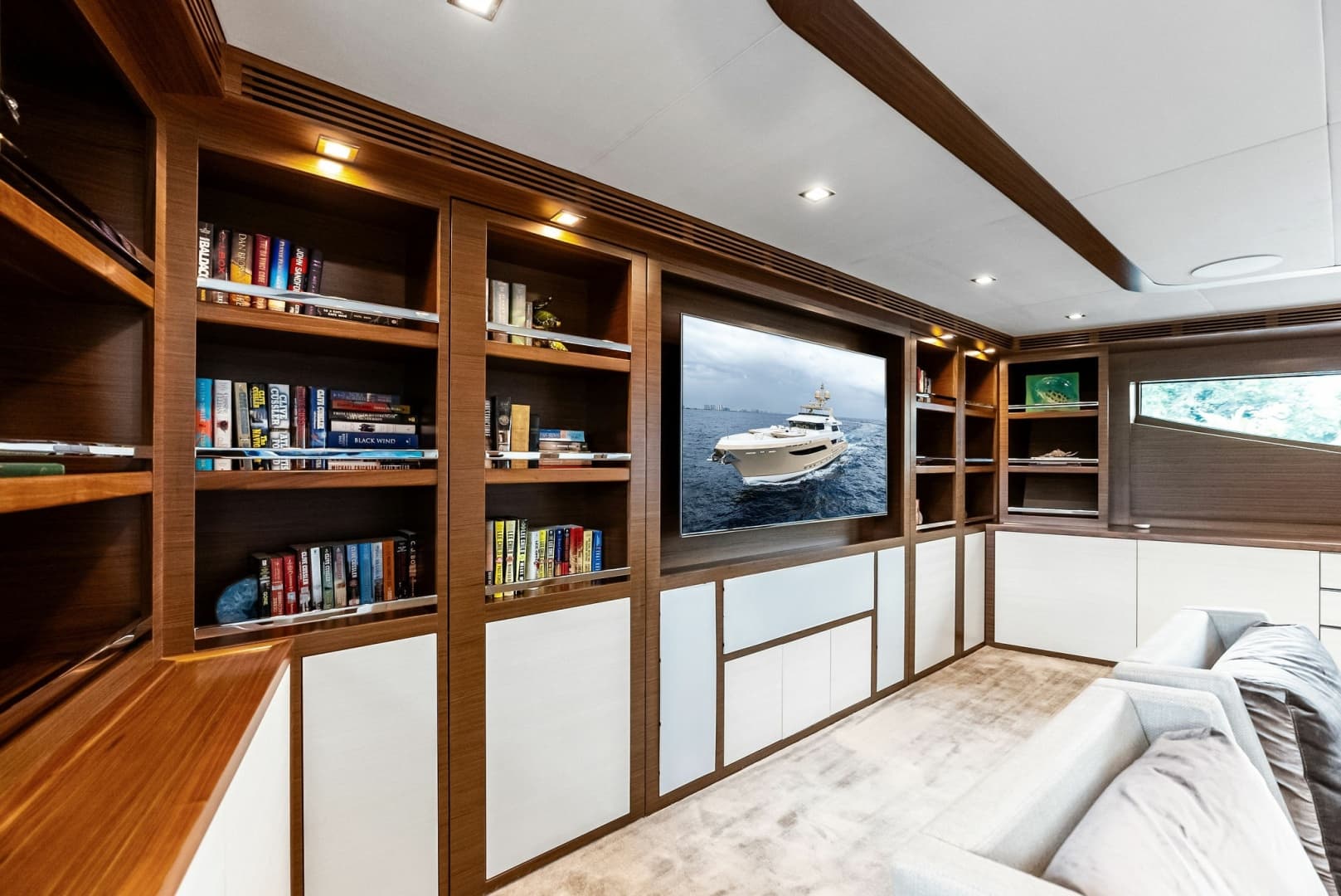 Library shelves, large video screen