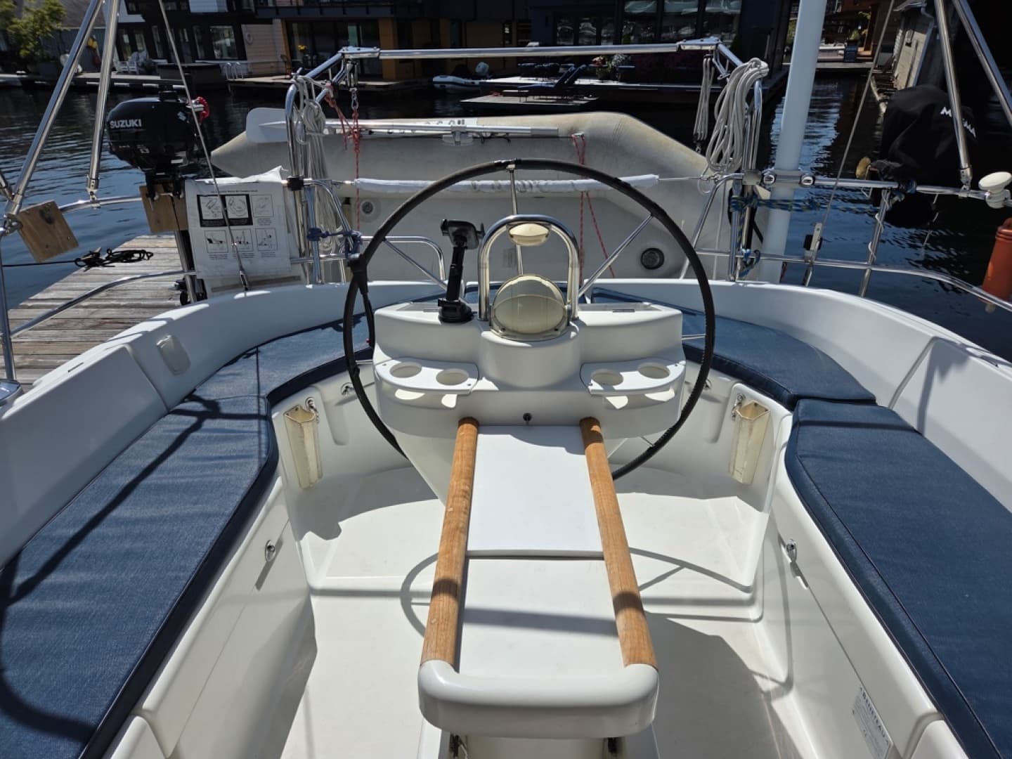 Cockpit of a 2000 Beneteau Oceanis 411 sailboat with steering wheel and seating