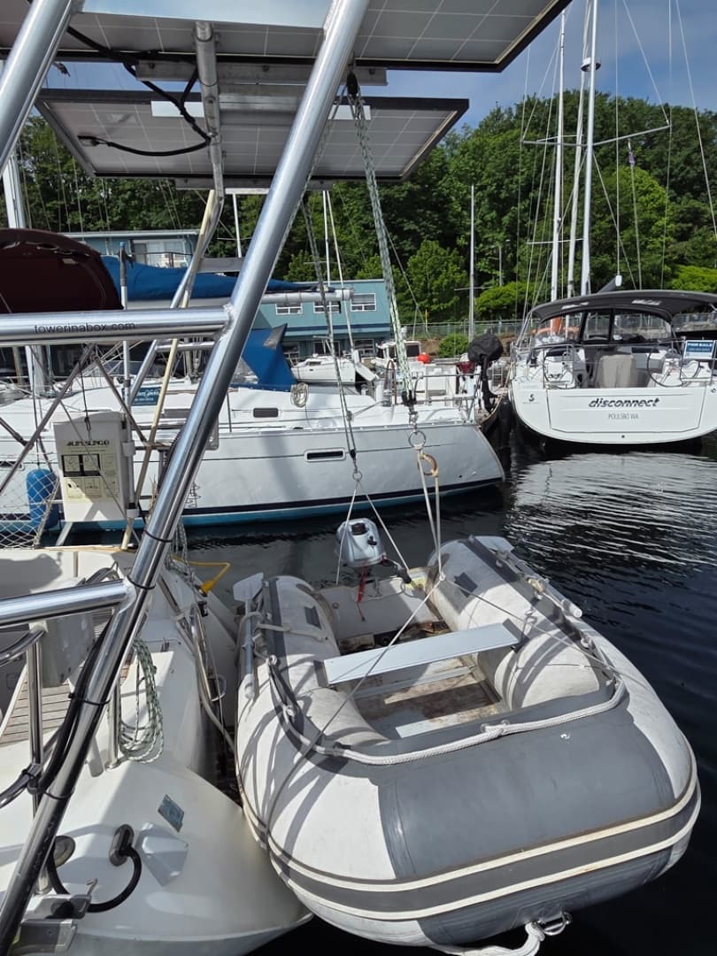 Dinghy w/ Honda outboard on davit system
