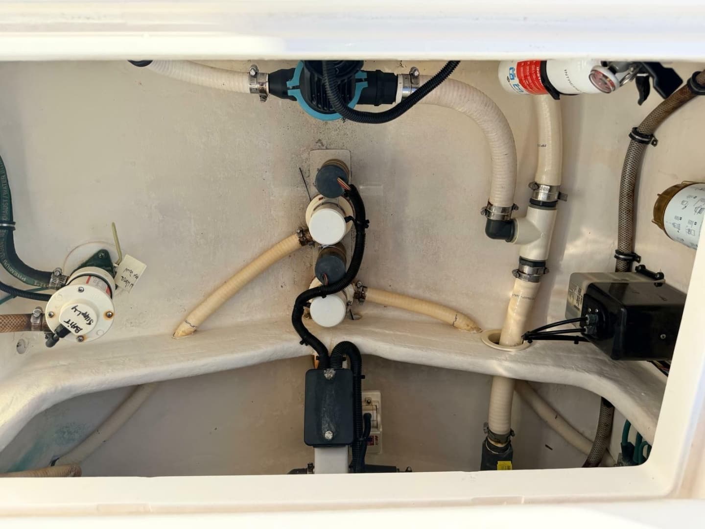 2017 Intrepid 327 Center Console for sale in Pompano Beach FL - bilge plumbing and pumps in a rear compartment