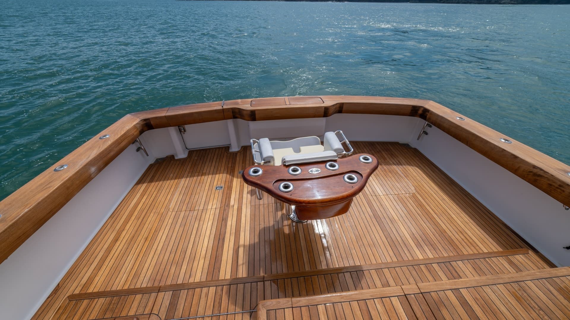 Spacious Teak Cockpit with Fighting Chair 2002 Viking 61 Convertible