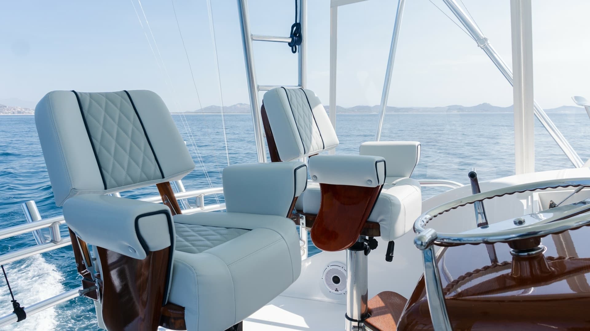 2009 Viking 50 Convertible "Jammin" - The Flybridge features Premium Captain's Chairs that Combine Comfort, Functionality, and Commanding Sightlines for an Elevated Boating Experience.